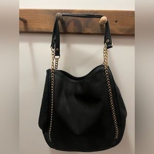 Black purse with gold hardware
